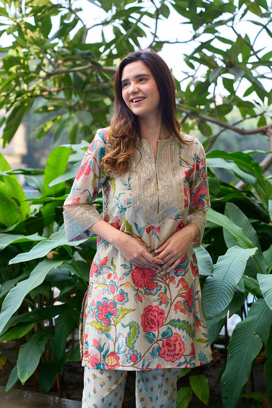 Pista colour digitally printed floral design kurta with silver lace yoke & digitally printed pants.