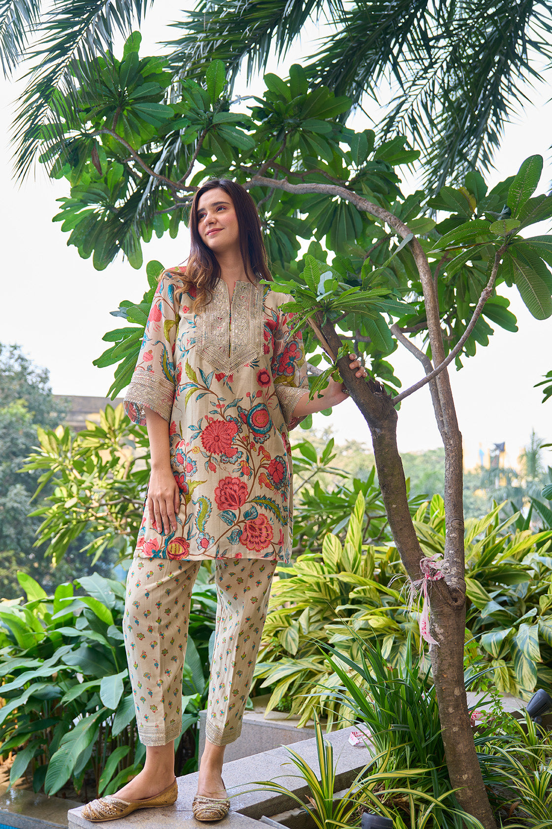 Pista colour digitally printed floral design kurta with silver lace yoke & digitally printed pants.