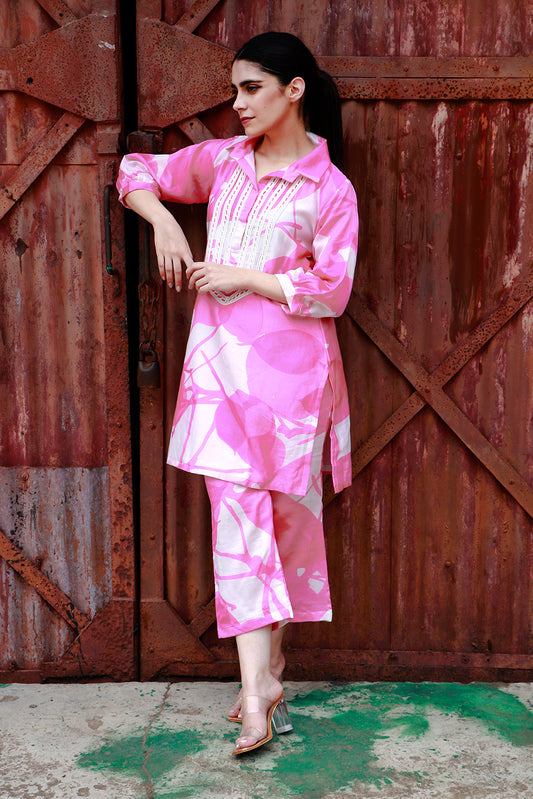 Pink abstract print tunic and pant set.