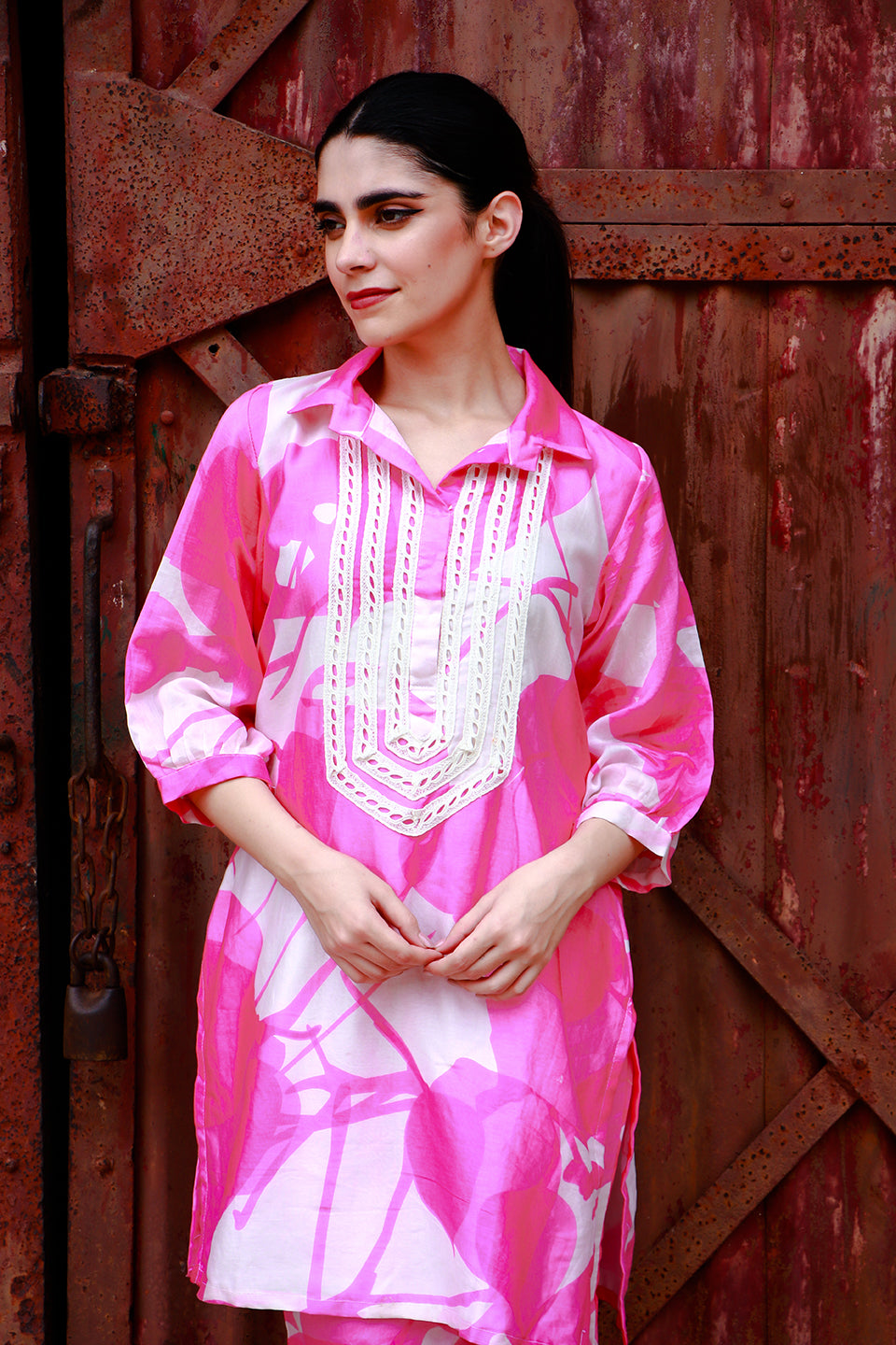 Pink abstract print tunic and pant set.